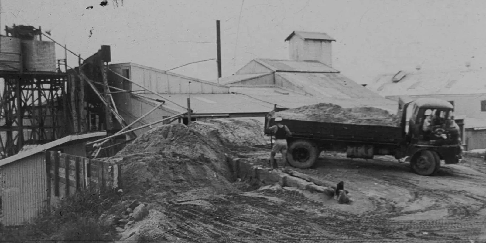 Historic black and white banner of the Neumann family mineral sands operation